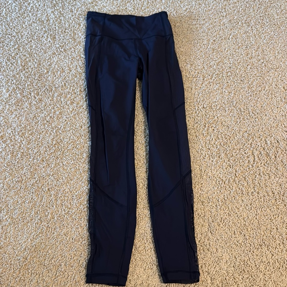 Navy Lululemon leggings. Size 6. Polka mesh detailing on side.